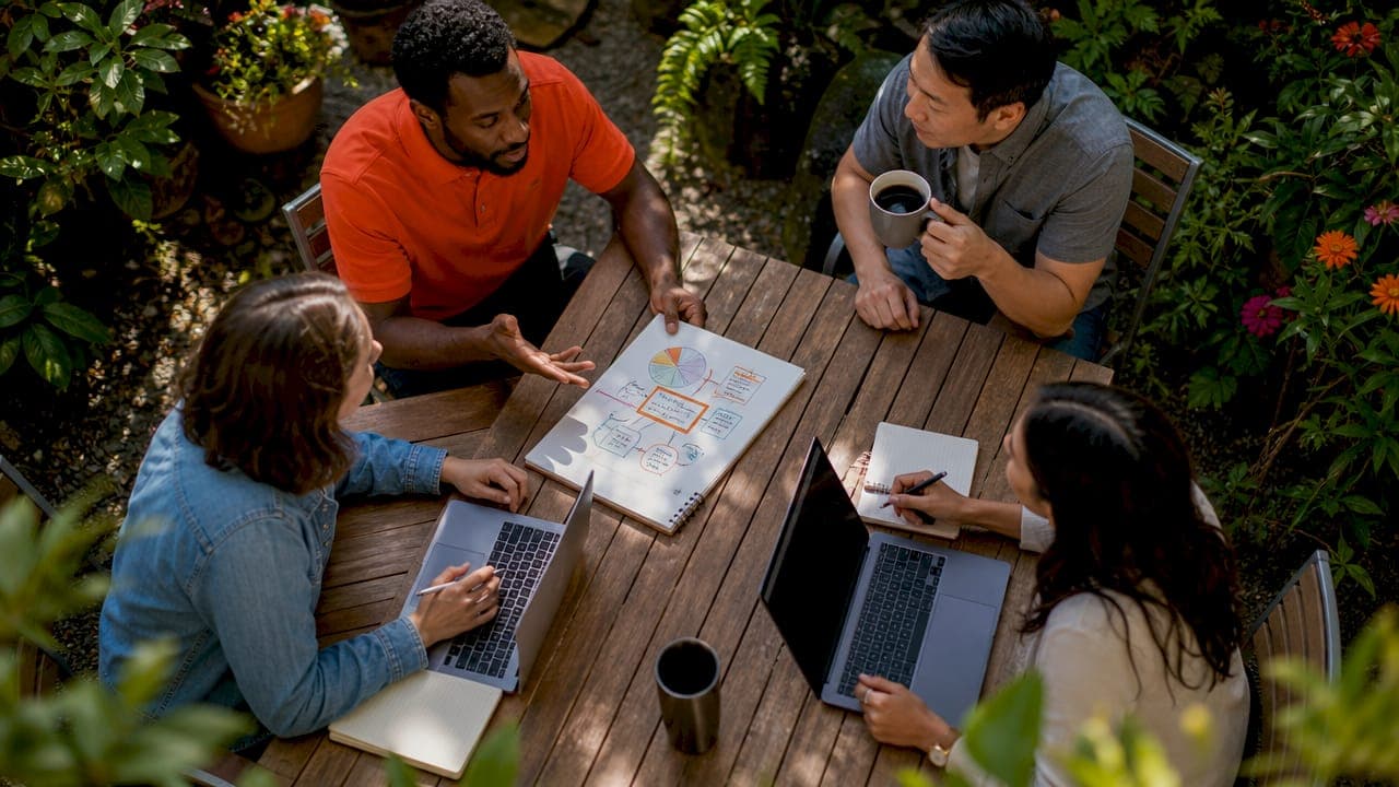 Diverse team discussing process design in meeting