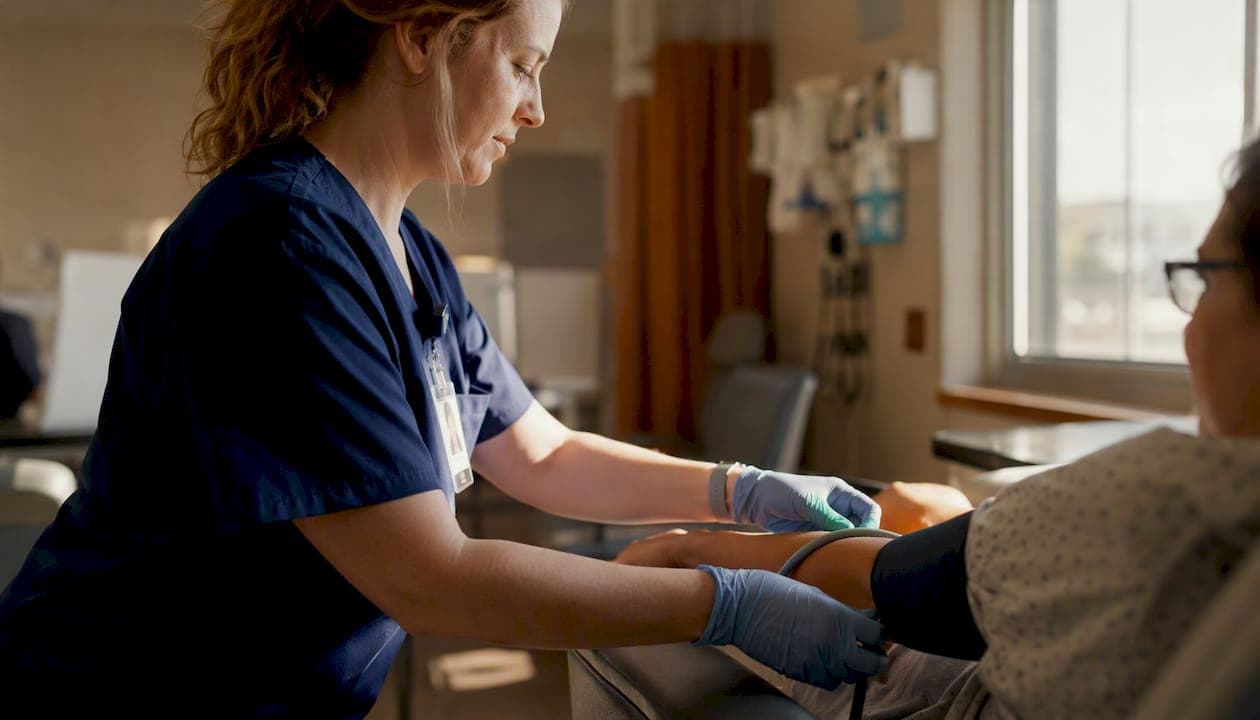 Nurse measuring patient vital signs in emergency triage