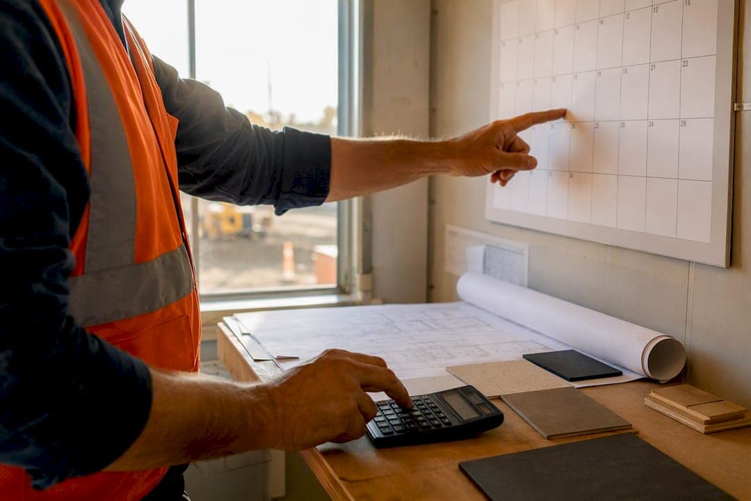 Foreman adjusting budget planning tools