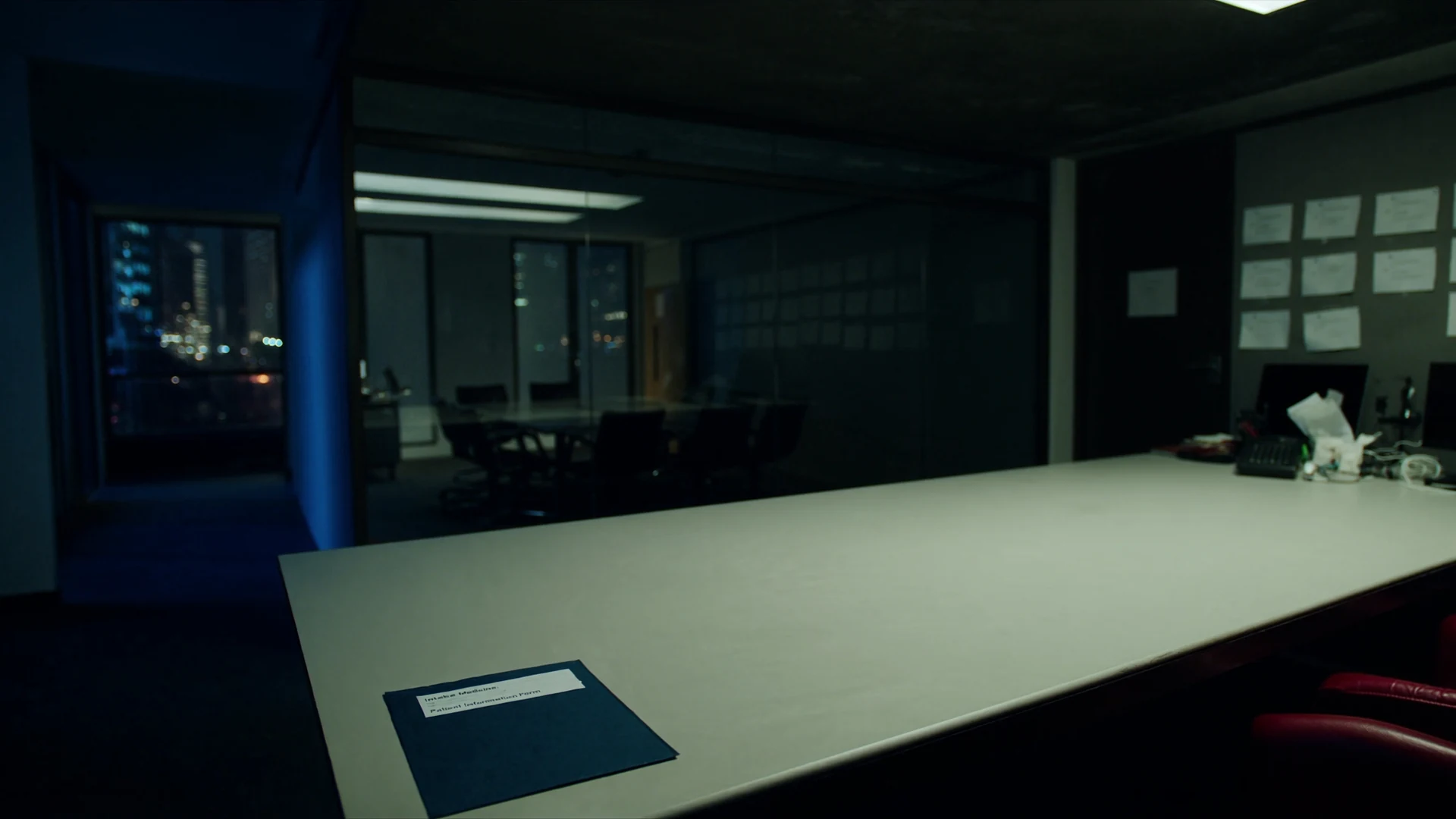 After-hours intake table, a closed folder on the white surface