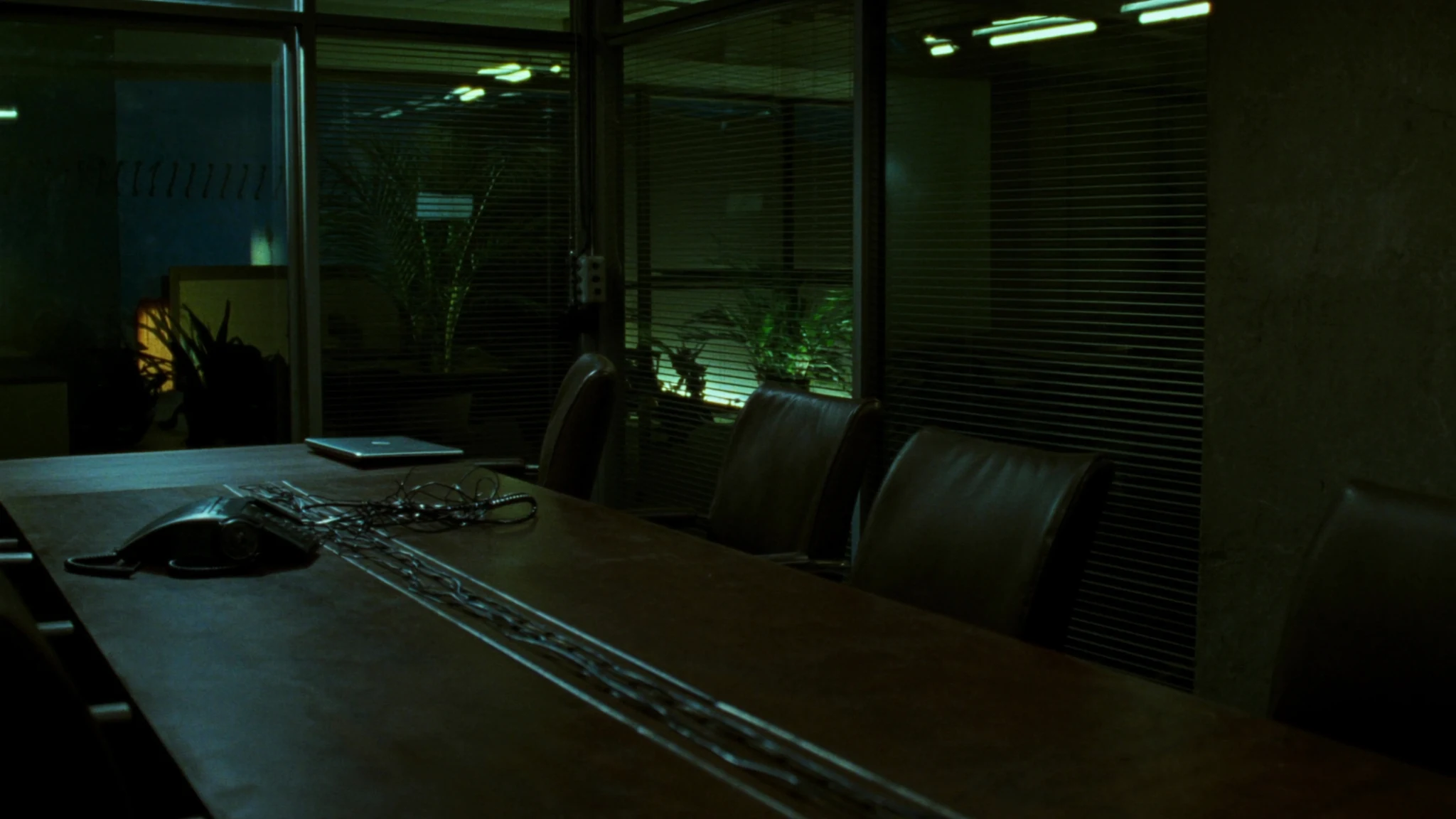 Night executive desk in a plant operations wing, the office after the meeting