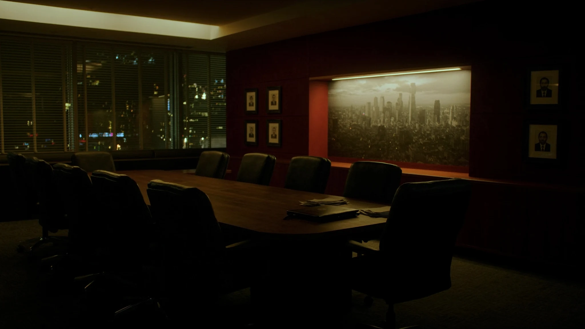 After-hours conference table in a bank, laptop and espresso waiting for a decision that has no owner