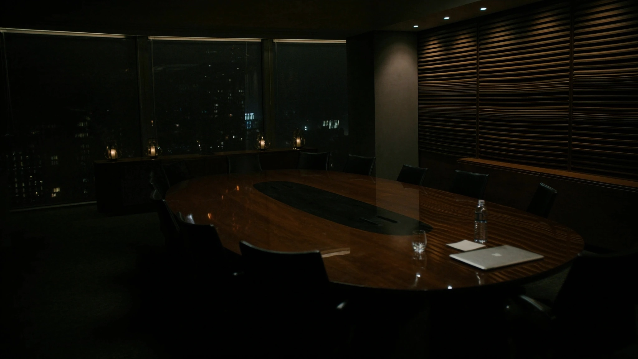 After-hours conference table in a health system, chairs waiting for a decision that has no owner