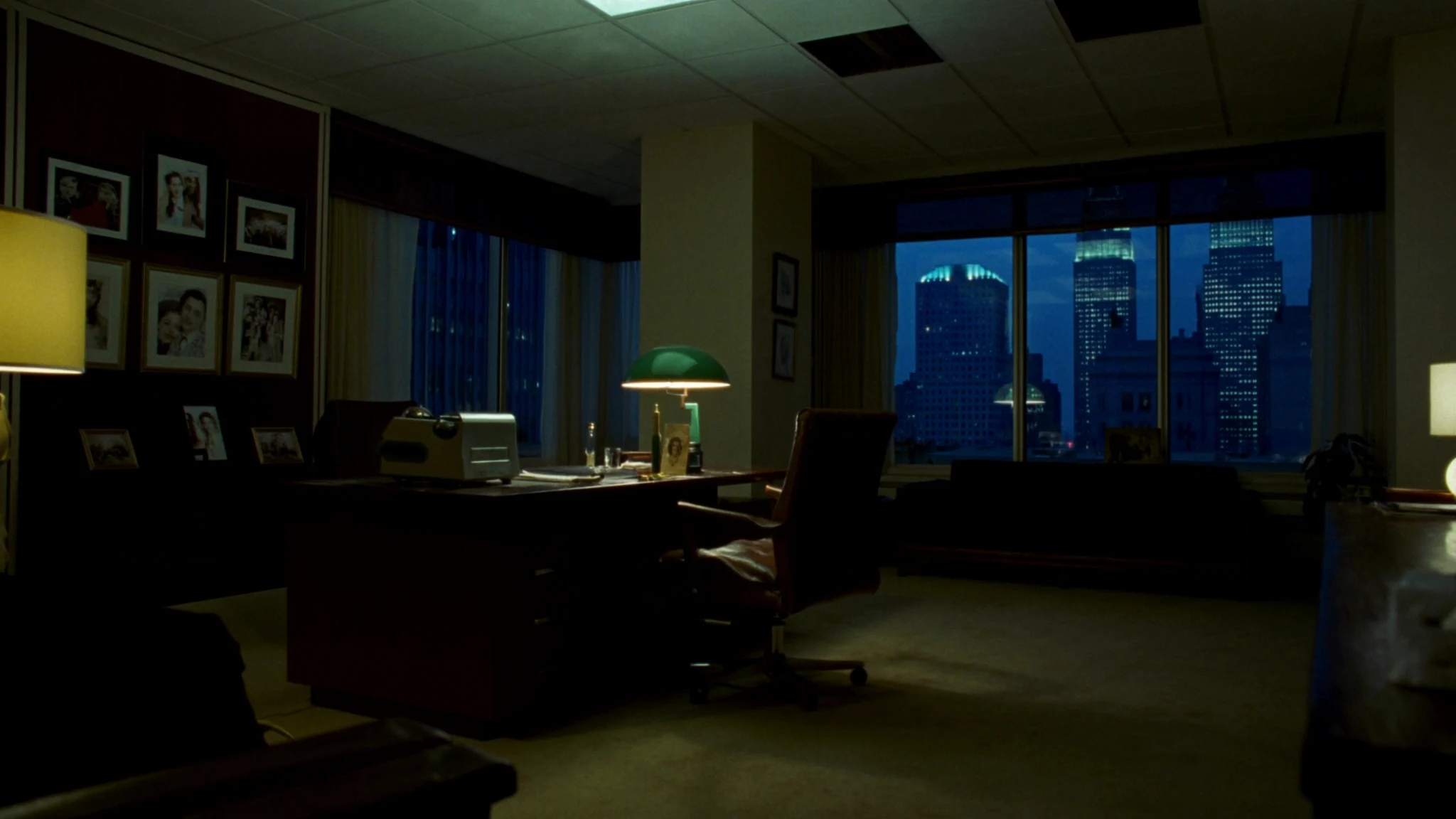Night executive desk in an insurance operations wing, the office after the meeting