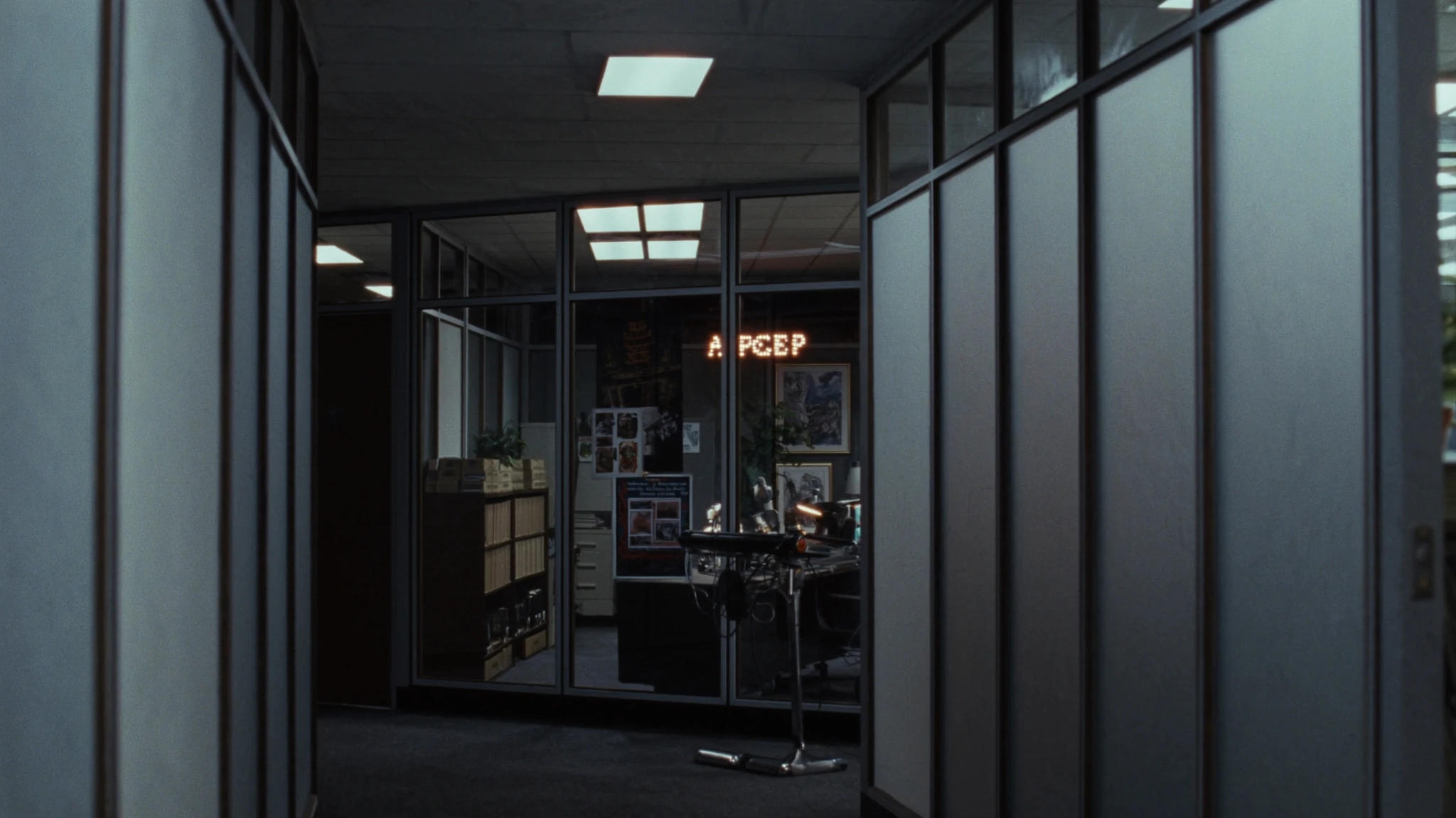 Night executive desk in a law-firm partnership wing, the office after the meeting