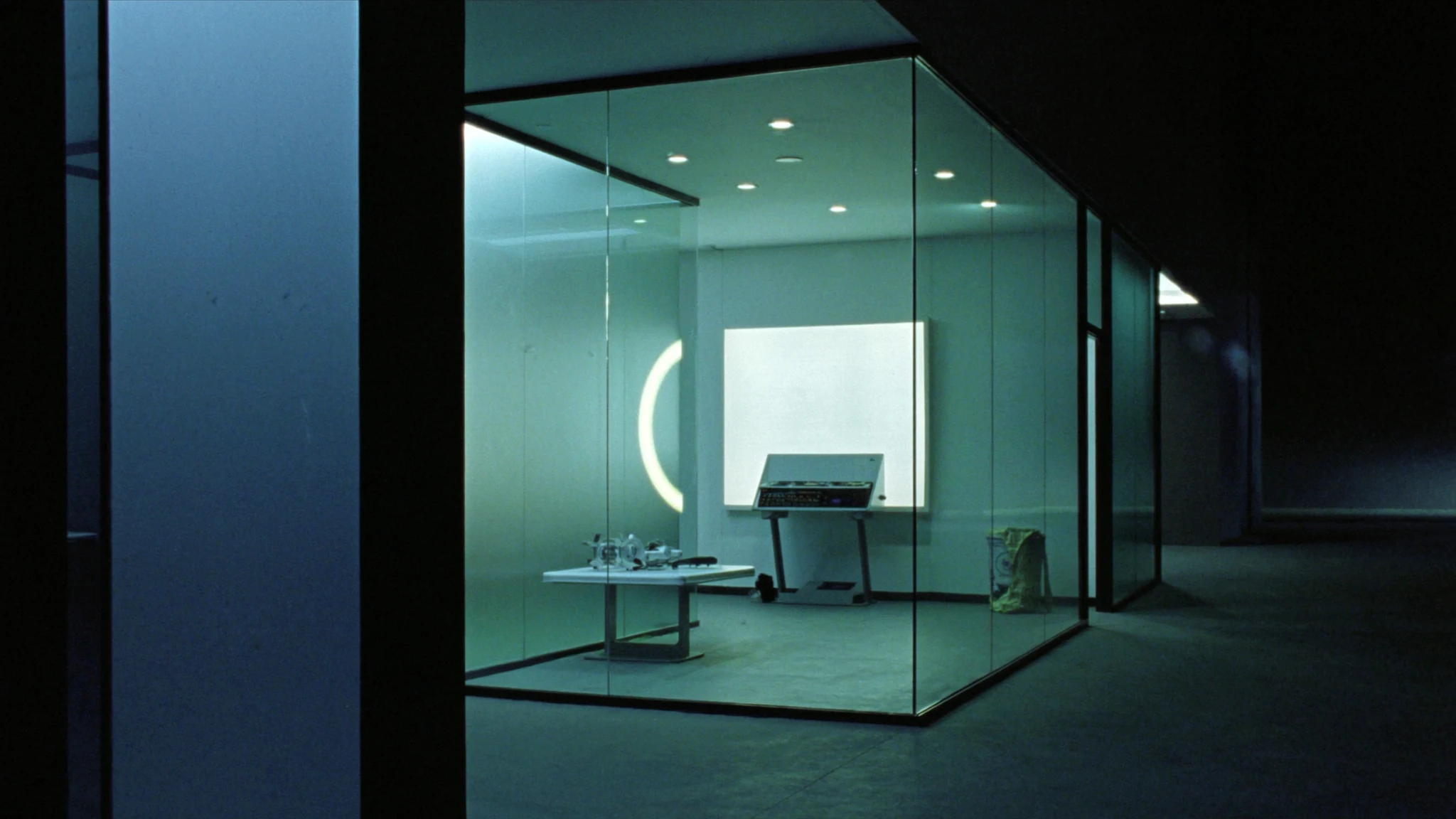 Night executive desk in a media operations wing, the office after the meeting